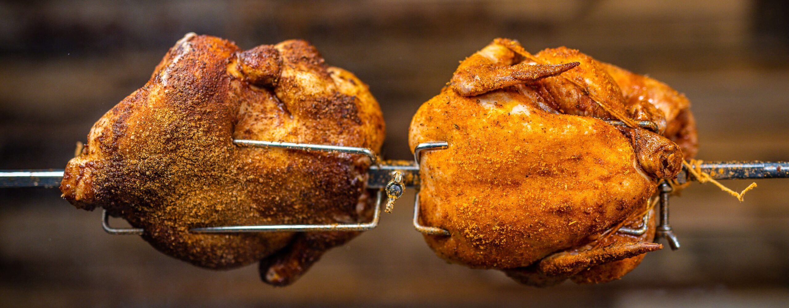 roasted chickens on a spit roaster